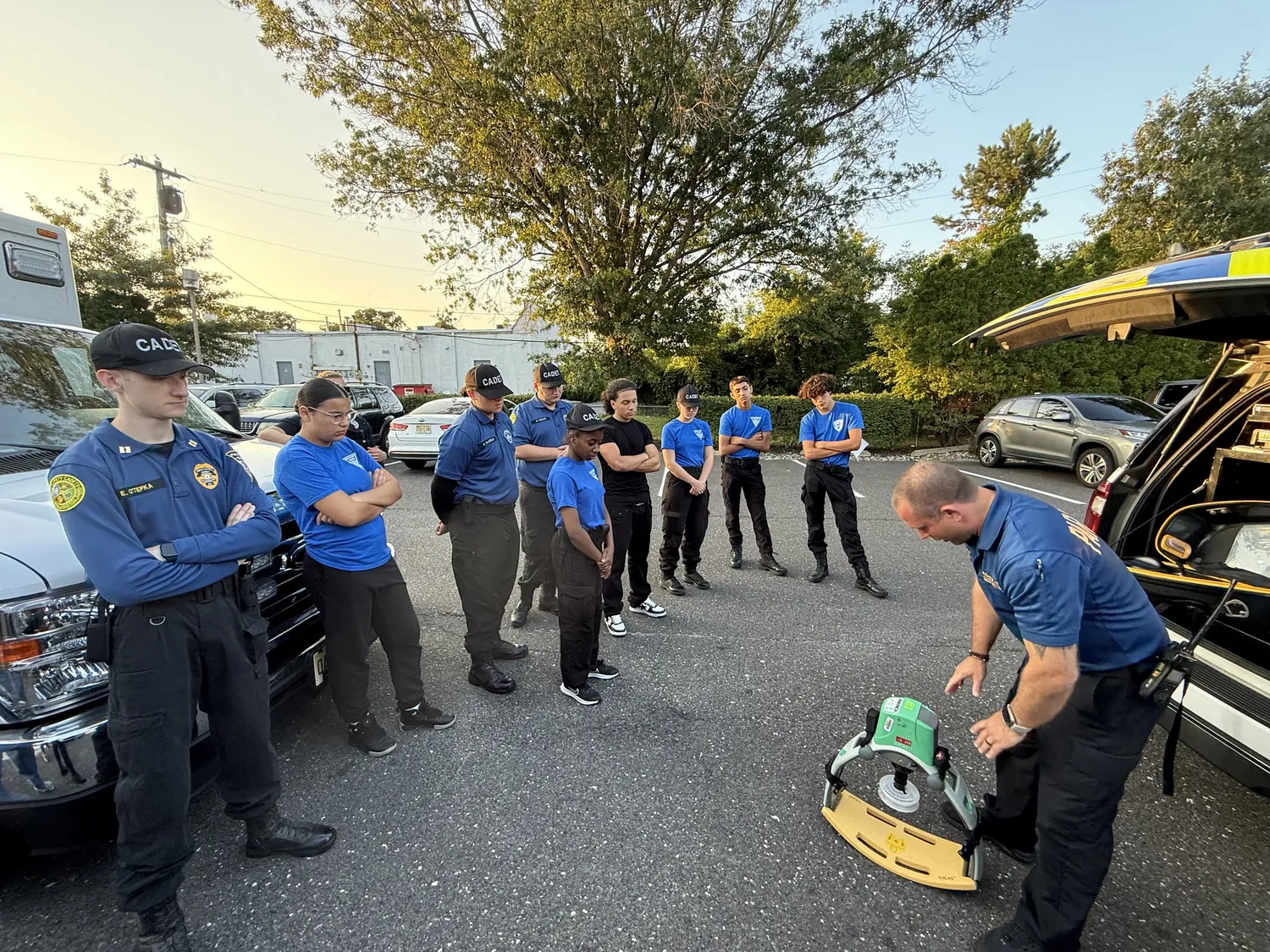 Cadets learning about emergency medical services (EMS) equipment from an instructor